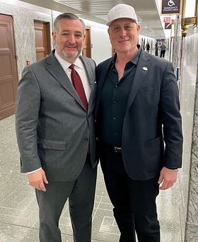 two men in suits in a corridor