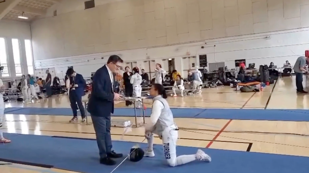 Stephanie Sullivan kneels
