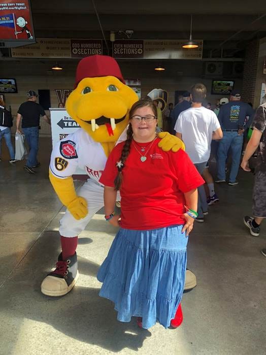 A person posing with a yellow snake mascot
AI-generated content may be incorrect. A person posing with a yellow snake mascot
AI-generated content may be incorrect.