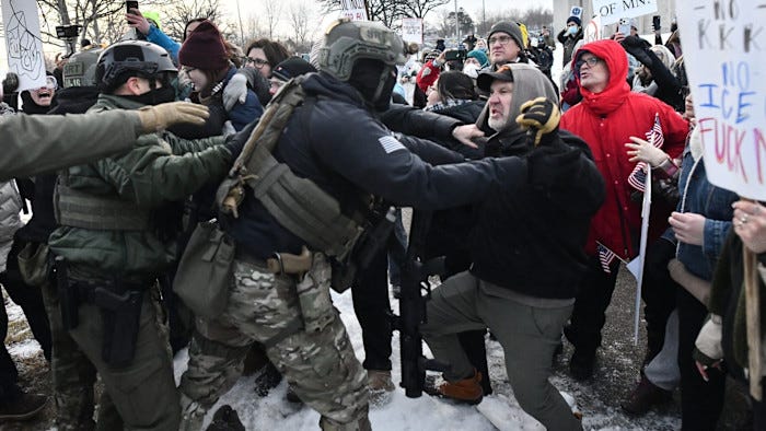 Protestors and armed federal agents struggle in close quarters, with shouting and signs visible amid a snowy street demonstration Protestors and armed federal agents struggle in close quarters, with shouting and signs visible amid a snowy street demonstration